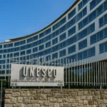 Role of UNESCO in Indian Tourism (2025) Front view of UNESCO headquarters building in Paris with clear blue sky