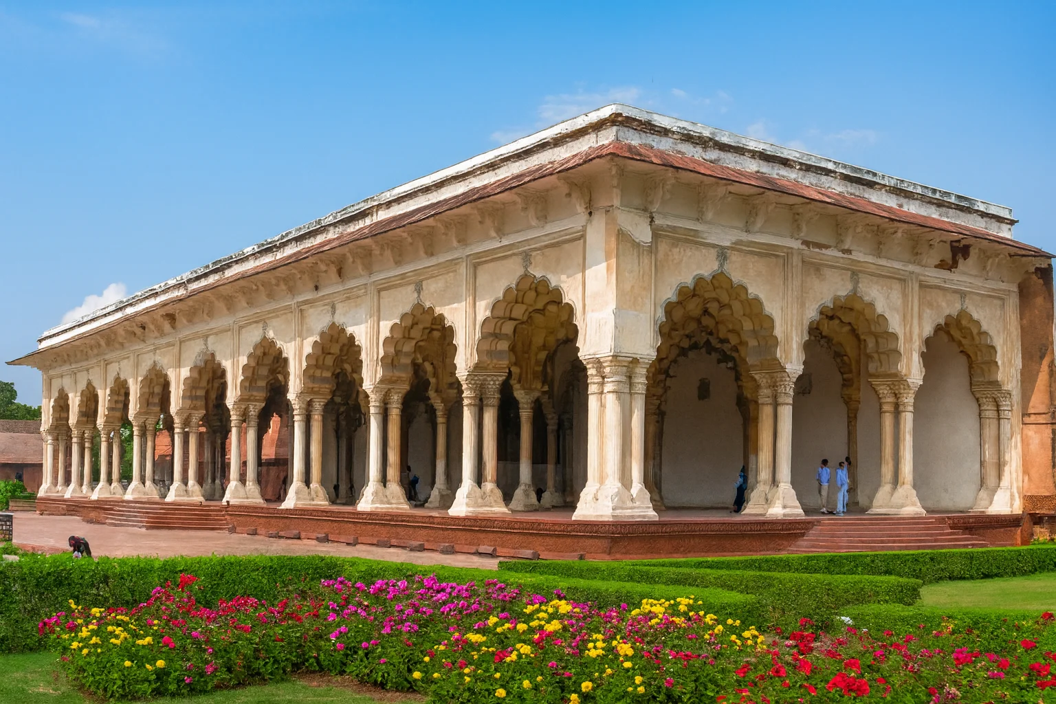 Diwan-i-Am with Gardens at Agra Fort Diwan-i-Am at Agra Fort with arches, marble columns, and blooming flower gardens.