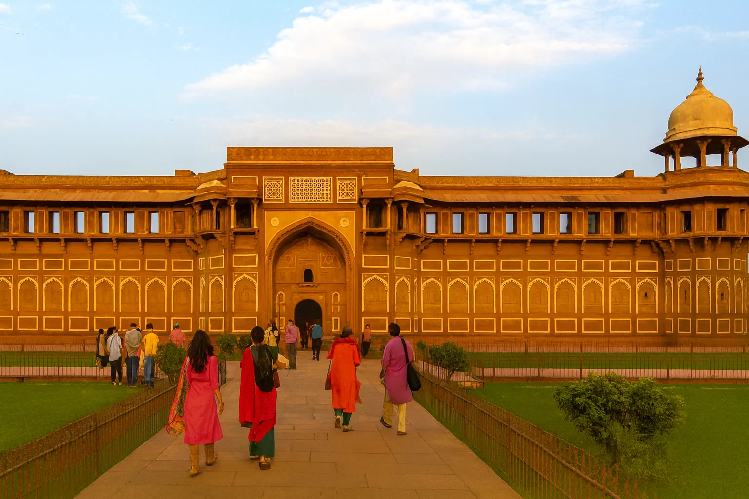 Jahangiri Mahal Agra Fort with Tourists at Sunset Tourists walking towards the grand Jahangiri Mahal inside Agra Fort, Agra