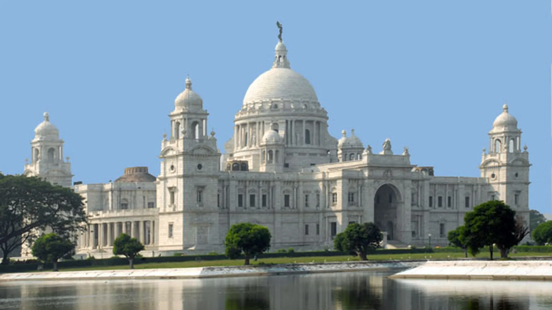 Victoria Memorial, Kolkata — white-marble monument Victoria Memorial, Kolkata — white-marble memorial and museum reflected in the foreground water garden.