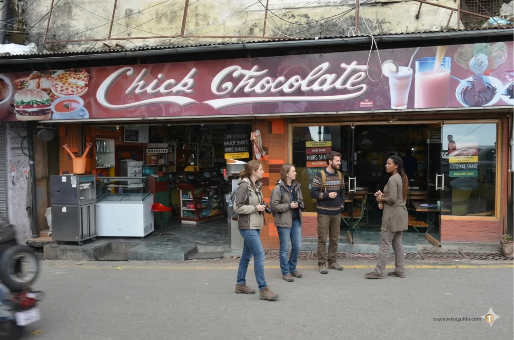 Chick Chocolate: Indulge In Mussoorie’s Sweetest Legacy Chick Chocolate Mussoorie storefront with red signage and glass doors.
