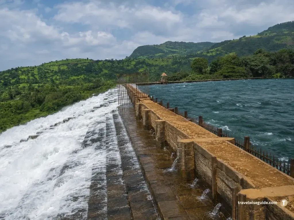 Bhushi Dam Lonavala: Experience Nature’s Cascading Monsoon Delight Bhushi Dam Lonavala overflows across stone steps beside green hills.
