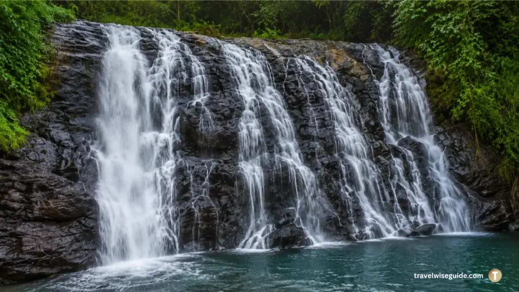 Abbey Falls Coorg Nature's Refreshing Escape Abbey Falls Coorg cascading waterfall over dark rocks with clear water below