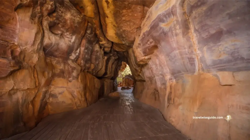 Bhimbetka: Journey Into Prehistoric Times Bhimbetka caves interior showing a wooden walkway between rock formations.