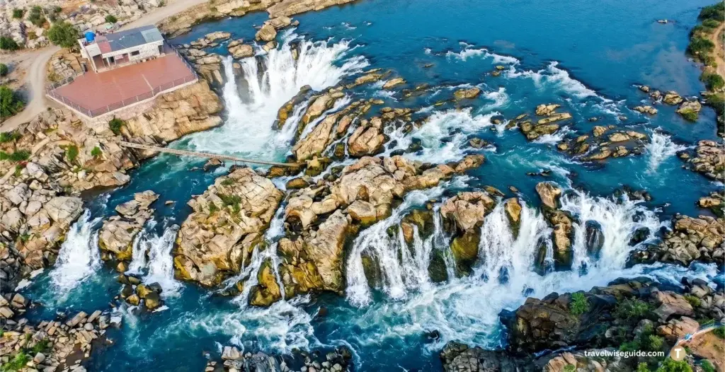 Bhedaghat Waterfall: Experience Nature's Raw Power Bhedaghat waterfall Jabalpur cascading over rocks in this travel article.