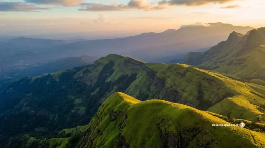 Kudremukh National Park: Majestic Wilderness Unfolded Kudremukh National Park rolling green mountain ridges under evening light.