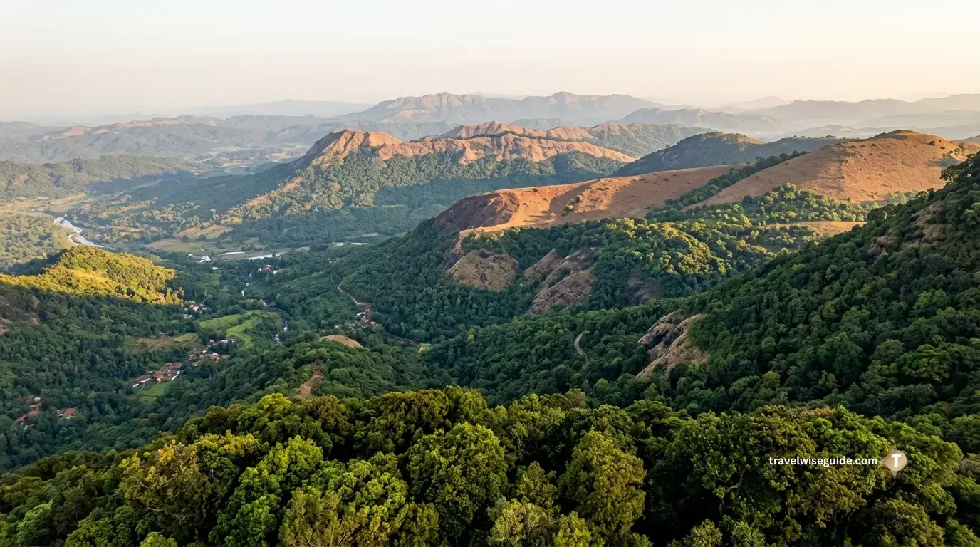 Kodachadri: Unveiling the Wild Heart of Karnataka Kodachadri forest trails overlook sunlit green ridges and rolling valleys.